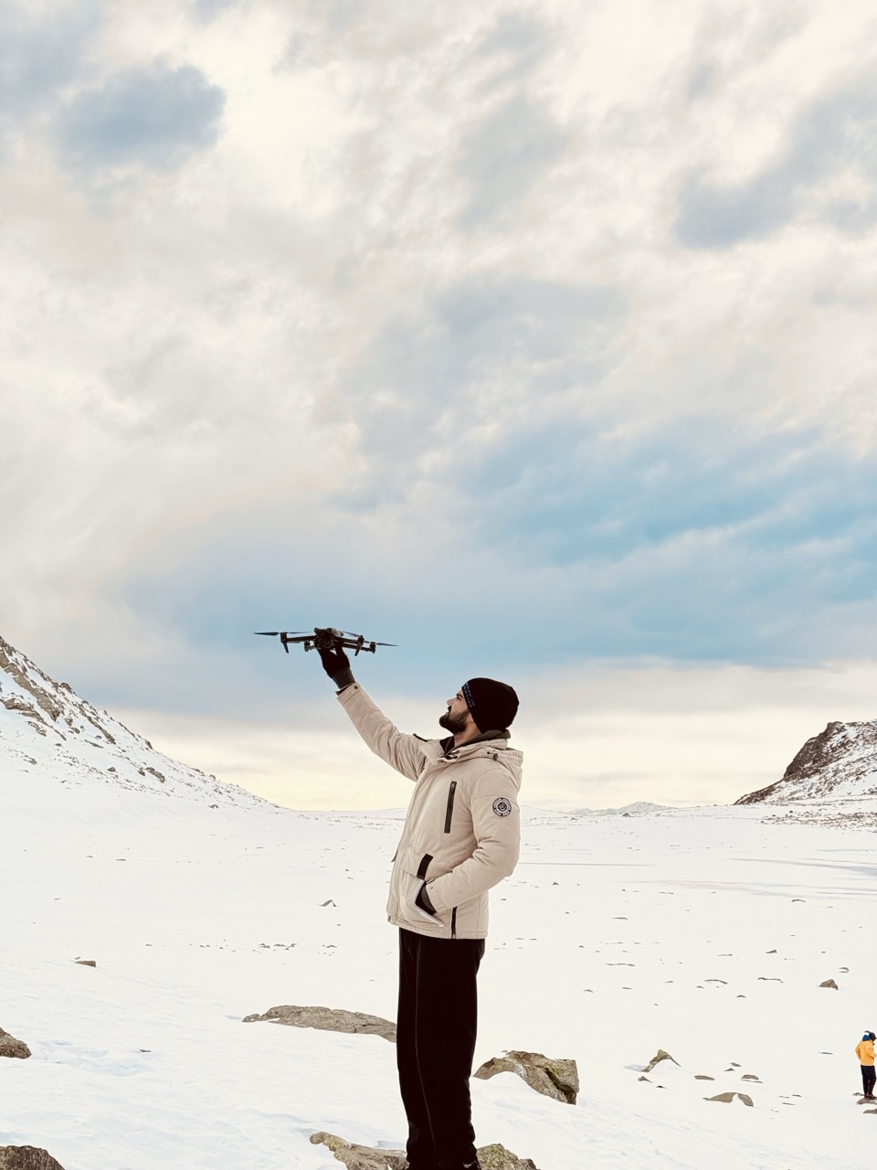 Pankaj Khandelwal launching a drone in the snow